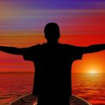 person, human, pleasure, sunset, sea, water, waves, boat, sun, orange, lust for life, cheers, silhouette, young people, boy, jocosity, comfort, be pleased with, satisfaction, merry mood, cheerful mood, happy courage, nature, frohsinn, joy, bliss